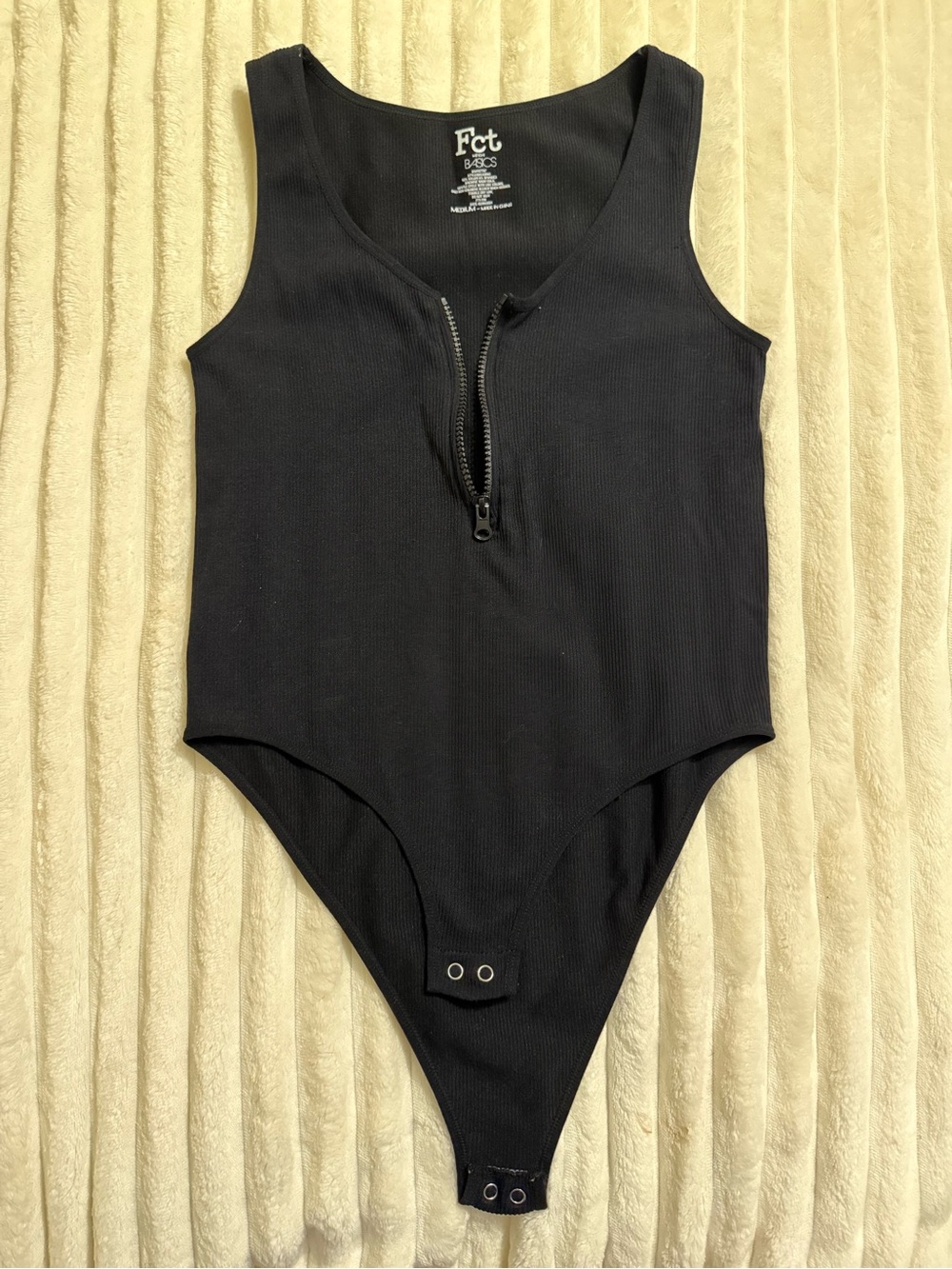Black Ribbed Zip Front One-Piece Bodysuit